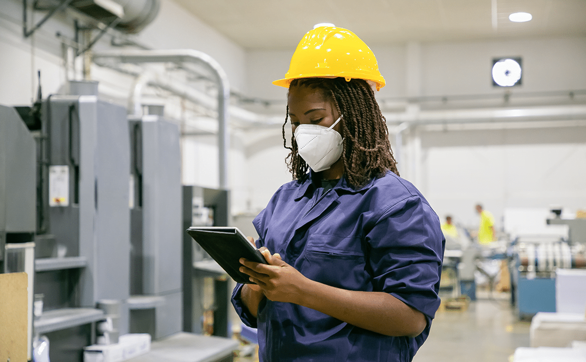 Employee in a food processing facility employing hygiene solutions